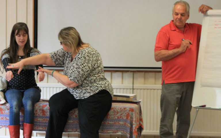 Creative Kinesiology practitioners learning with us at a training event